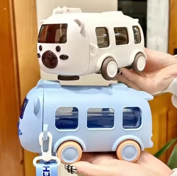500ml bus-shaped water bottle Typically featuring moving wheels, a shoulder strap, and a straw for drinking.